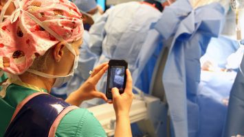 A nurse takes a photo during a recent surgery on an 8 year old boy at Arnold Palmer Hospital for Children in Orlando, Florida.  Doctors there have developed an app that allows nurses to safely and securely send texts, photos and videos from the OR directly to the smartphones of family members in an effort to keep them informed on progress during surgical procedures.  See how the app works here: bit.ly/1x820XI